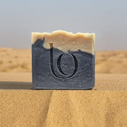 Bar of tallow soap with our logo on sand dunes